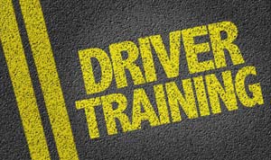 Driver training painted on road in yellow